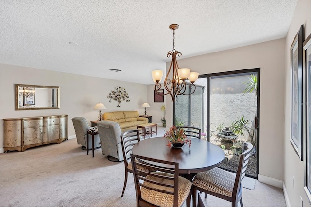3914 Glen Oaks Manor Dr, Sarasota, FL 34232 - dining space with a chandelier, light carpet, a textured ceiling, and baseboards