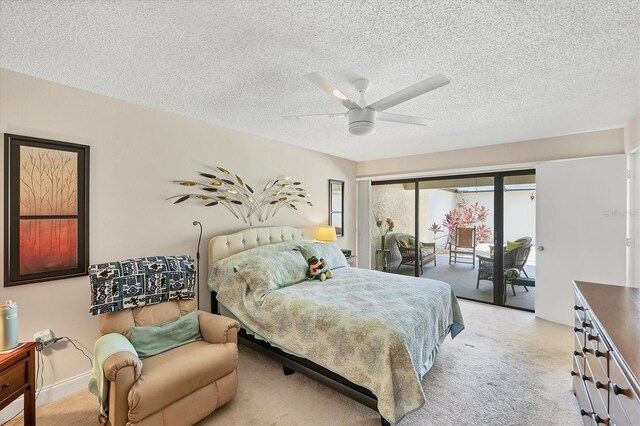 3914 Glen Oaks Manor Dr, Sarasota, FL 34232 - bedroom with access to exterior, a textured ceiling, ceiling fan, and light carpet