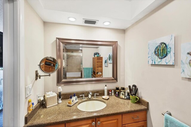 3914 Glen Oaks Manor Dr, Sarasota, FL 34232 - full bath featuring a shower with door, vanity, and recessed lighting