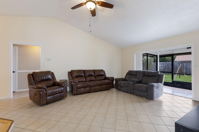 613 E 49th St E, Bradenton, FL 34208 - living area with vaulted ceiling, ceiling fan, and light tile patterned flooring