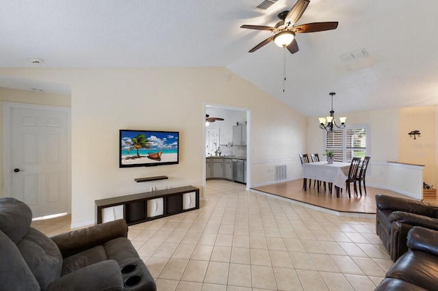 613 E 49th St E, Bradenton, FL 34208 - living room featuring ceiling fan, a chandelier, lofted ceiling, light tile patterned floors, and a textured ceiling