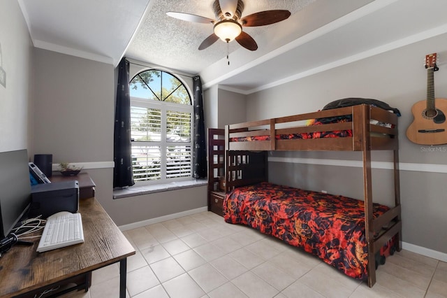 613 E 49th St E, Bradenton, FL 34208 - tiled bedroom with baseboards, a textured ceiling, and ceiling fan