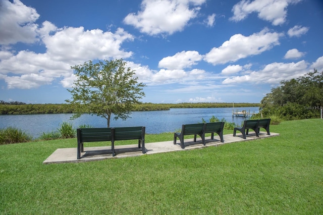 613 E 49th St E, Bradenton, FL 34208 - surrounding community featuring a water view and a lawn
