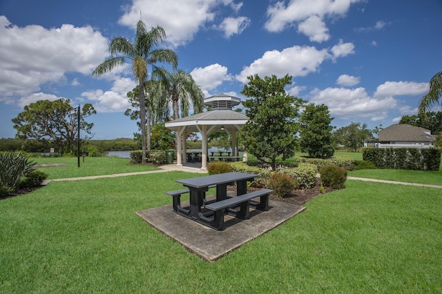 613 E 49th St E, Bradenton, FL 34208 - view of community with a gazebo, a yard, and a water view