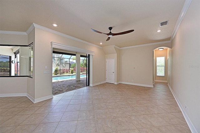 12644 20th St E, Parrish, FL 34219 - empty room featuring a ceiling fan, arched walkways, ornamental molding, recessed lighting, and baseboards