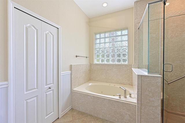 12644 20th St E, Parrish, FL 34219 - full bathroom featuring a stall shower, a tub with jets, a wainscoted wall, and tile patterned floors