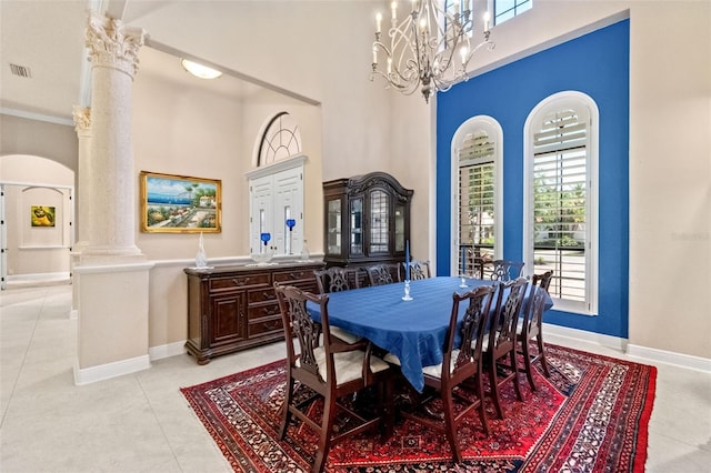 6808 Belmont Ct, Lakewood Ranch, FL 34202 - dining room with decorative columns, plenty of natural light, a towering ceiling, baseboards, and a chandelier