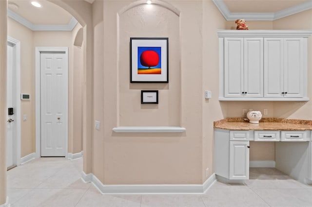 6808 Belmont Ct, Lakewood Ranch, FL 34202 - corridor featuring ornamental molding, light tile patterned floors, arched walkways, and baseboards