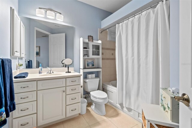 6808 Belmont Ct, Lakewood Ranch, FL 34202 - bathroom featuring tile patterned flooring, toilet, vanity, and shower / tub combo