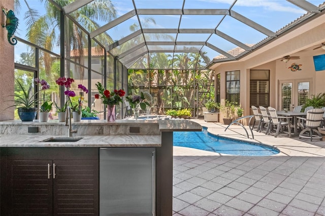 6808 Belmont Ct, Lakewood Ranch, FL 34202 - outdoor pool featuring a sink, a patio area, a ceiling fan, glass enclosure, and french doors