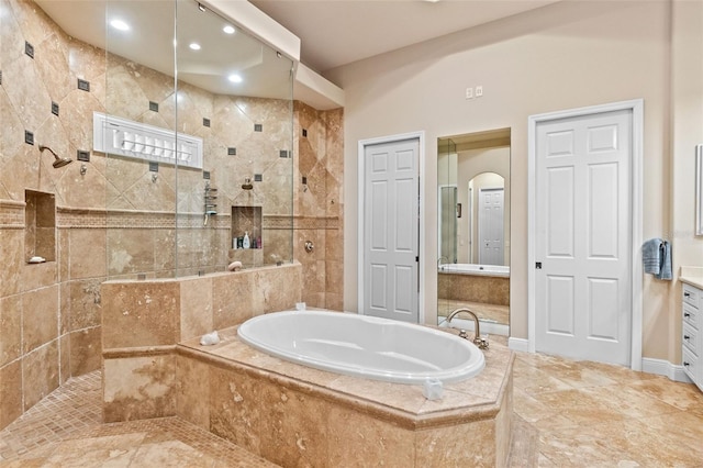 6808 Belmont Ct, Lakewood Ranch, FL 34202 - bathroom featuring a garden tub, tiled shower, vanity, and recessed lighting