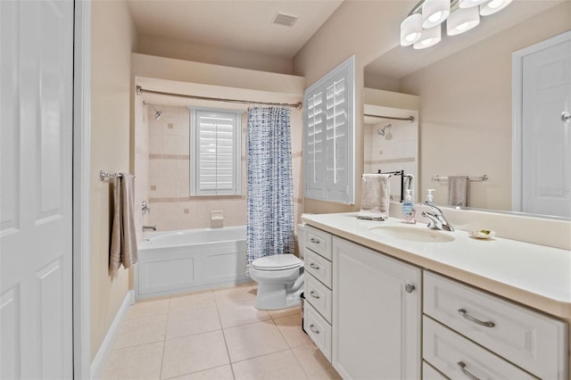 6808 Belmont Ct, Lakewood Ranch, FL 34202 - full bathroom featuring vanity, shower / tub combo with curtain, tile patterned floors, toilet, and baseboards