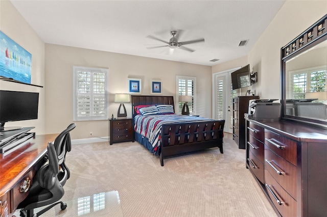 6808 Belmont Ct, Lakewood Ranch, FL 34202 - bedroom featuring an office area, light carpet, multiple windows, and baseboards