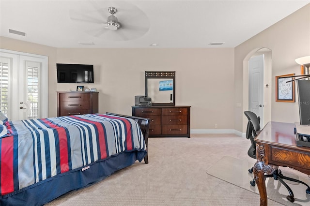 6808 Belmont Ct, Lakewood Ranch, FL 34202 - bedroom with light carpet, arched walkways, a ceiling fan, a desk, and baseboards