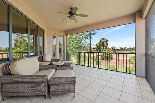 6808 Belmont Ct, Lakewood Ranch, FL 34202 - sunroom featuring ceiling fan, a water view, tile patterned floors, and french doors