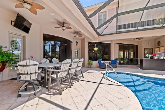 6808 Belmont Ct, Lakewood Ranch, FL 34202 - swimming pool with ceiling fan, a patio area, and outdoor dining space