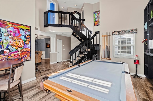 2306 63rd St W Unit 40, Bradenton, FL 34209 - recreation room featuring ornate columns, a high ceiling, wood finished floors, baseboards, and billiards table