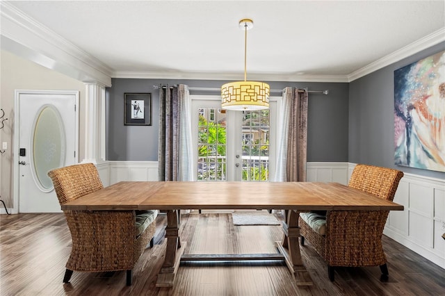 2306 63rd St W Unit 40, Bradenton, FL 34209 - dining room featuring a decorative wall, ornamental molding, wainscoting, and wood finished floors