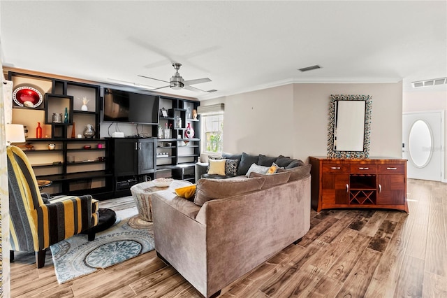2306 63rd St W Unit 40, Bradenton, FL 34209 - living room featuring crown molding, wood finished floors, and a ceiling fan