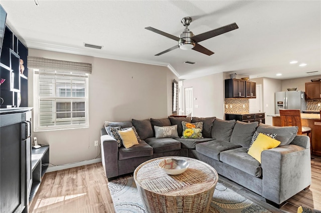 2306 63rd St W Unit 40, Bradenton, FL 34209 - living room with ceiling fan, light wood-type flooring, crown molding, recessed lighting, and baseboards