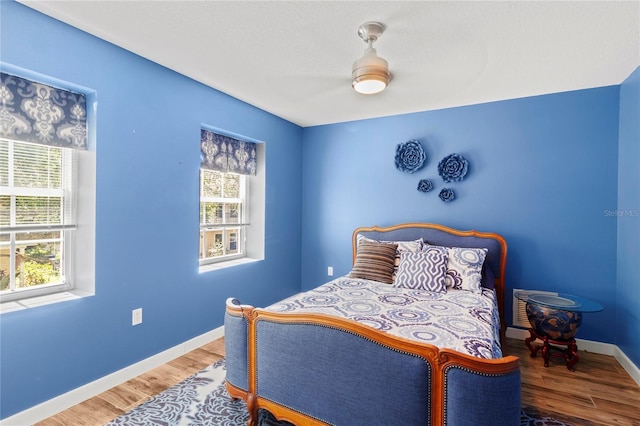 2306 63rd St W Unit 40, Bradenton, FL 34209 - bedroom featuring wood finished floors and baseboards