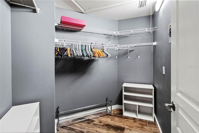 2306 63rd St W Unit 40, Bradenton, FL 34209 - walk in closet featuring wood finished floors