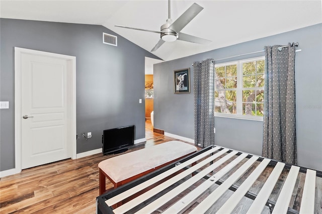 2306 63rd St W Unit 40, Bradenton, FL 34209 - bedroom with lofted ceiling, wood finished floors, ceiling fan, and baseboards