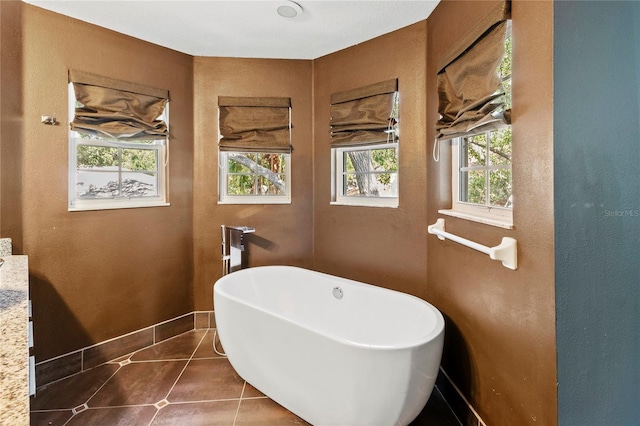 2306 63rd St W Unit 40, Bradenton, FL 34209 - bathroom featuring a soaking tub and tile patterned flooring