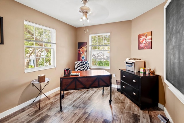 2306 63rd St W Unit 40, Bradenton, FL 34209 - office space featuring a ceiling fan, wood finished floors, and baseboards