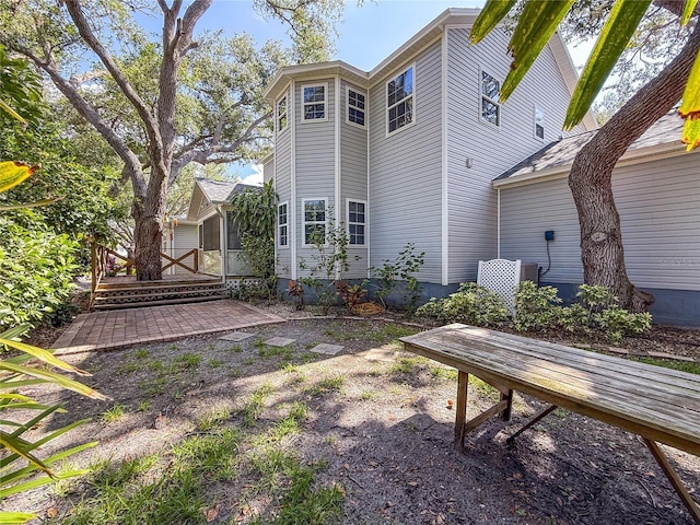2306 63rd St W Unit 40, Bradenton, FL 34209 - rear view of property with a wooden deck