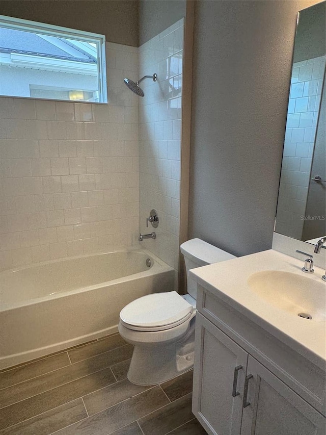 24831 Buckingham Way, Port Charlotte, FL 33980 - full bathroom with wood finish floors,  shower combination, toilet, and vanity