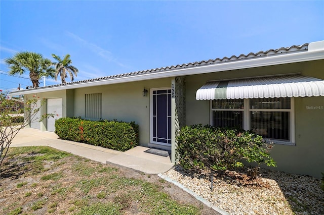 135 Gulfview Rd, Punta Gorda, FL 33950 - doorway to property featuring stucco siding