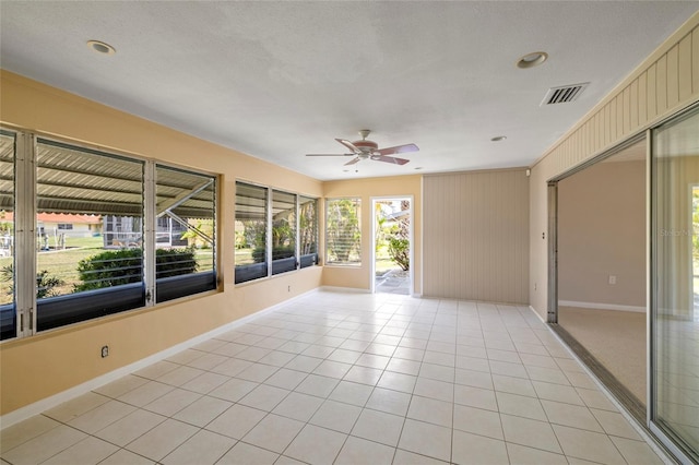 135 Gulfview Rd, Punta Gorda, FL 33950 - unfurnished sunroom featuring baseboards and tile patterned flooring