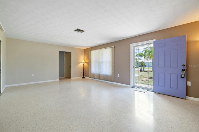 135 Gulfview Rd, Punta Gorda, FL 33950 - unfurnished room featuring baseboards and speckle patterned floor
