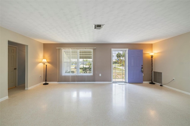 135 Gulfview Rd, Punta Gorda, FL 33950 - spare room featuring baseboards and speckle patterned floor
