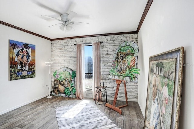 7321 Caladesia Dr, Sarasota, FL 34243 - sitting room with ornamental molding, ceiling fan, wood finished floors, and baseboards