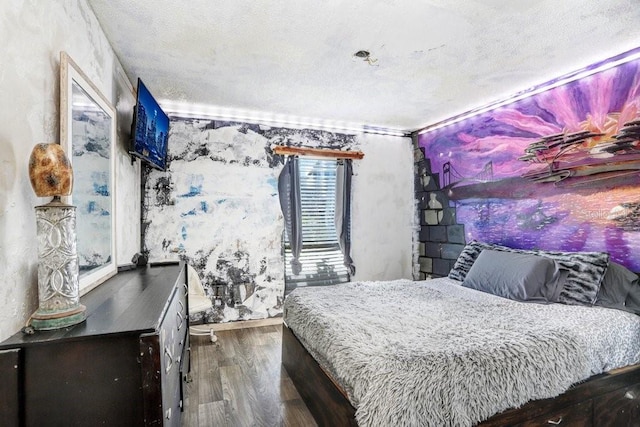 7321 Caladesia Dr, Sarasota, FL 34243 - bedroom with wood finished floors, a textured ceiling, and ornamental molding