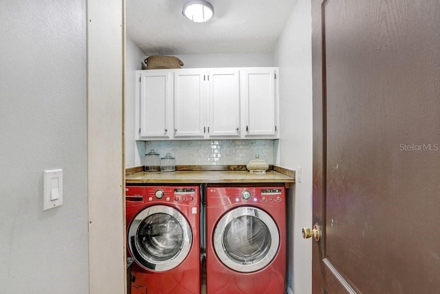 7321 Caladesia Dr, Sarasota, FL 34243 - laundry area featuring washer and dryer and cabinet space
