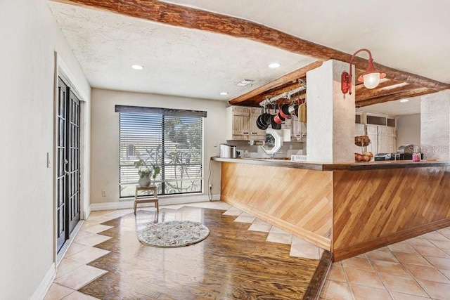 7321 Caladesia Dr, Sarasota, FL 34243 - kitchen with light tile patterned floors, recessed lighting, baseboards, and a textured ceiling