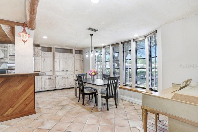7321 Caladesia Dr, Sarasota, FL 34243 - dining space with light tile patterned flooring, recessed lighting, and baseboards