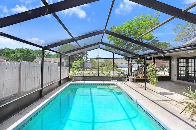 7321 Caladesia Dr, Sarasota, FL 34243 - view of swimming pool featuring a patio, french doors, and a lanai