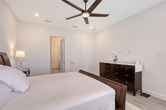 11427 Viani Ter, Palmetto, FL 34221 - bedroom featuring baseboards, light wood finished floors, ceiling fan, and recessed lighting