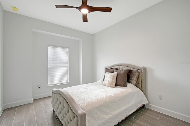 11427 Viani Ter, Palmetto, FL 34221 - bedroom with baseboards, wood finish floors, and ceiling fan