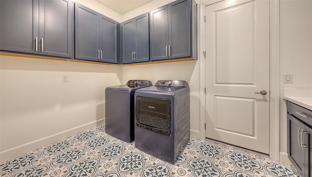 11427 Viani Ter, Palmetto, FL 34221 - laundry room with baseboards, separate washer and dryer, and cabinet space