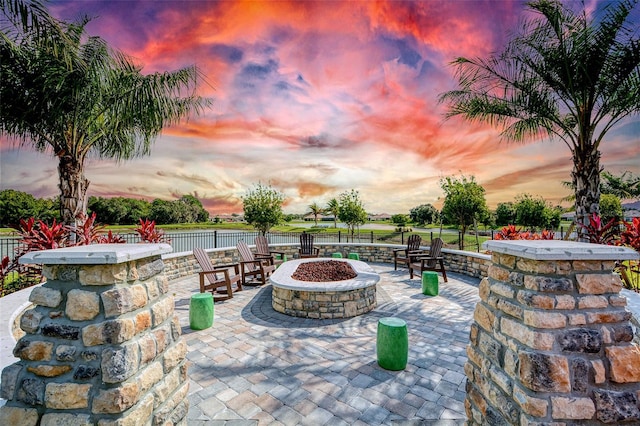 11427 Viani Ter, Palmetto, FL 34221 - view of patio / terrace with an outdoor fire pit