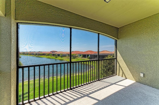 121 Porta Vecchio Bnd Unit 201, Nokomis, FL 34275 - unfurnished sunroom with a water view and a residential view