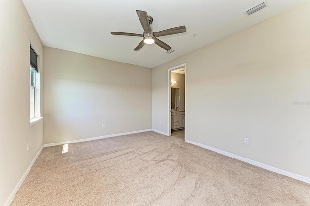 121 Porta Vecchio Bnd Unit 201, Nokomis, FL 34275 - spare room featuring light carpet, ceiling fan, and baseboards