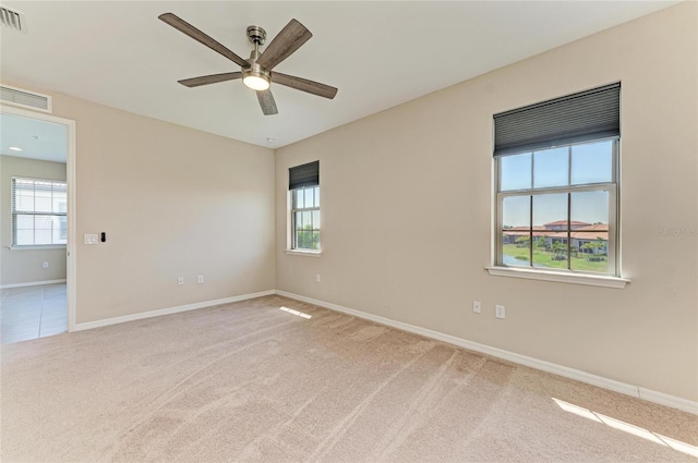 121 Porta Vecchio Bnd Unit 201, Nokomis, FL 34275 - unfurnished room with carpet, plenty of natural light, ceiling fan, and baseboards