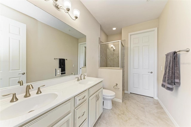 121 Porta Vecchio Bnd Unit 201, Nokomis, FL 34275 - bathroom featuring a shower stall, double vanity, tile patterned floors, toilet, and baseboards