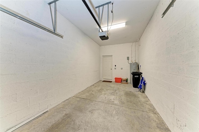 121 Porta Vecchio Bnd Unit 201, Nokomis, FL 34275 - garage featuring a garage door opener and water heater